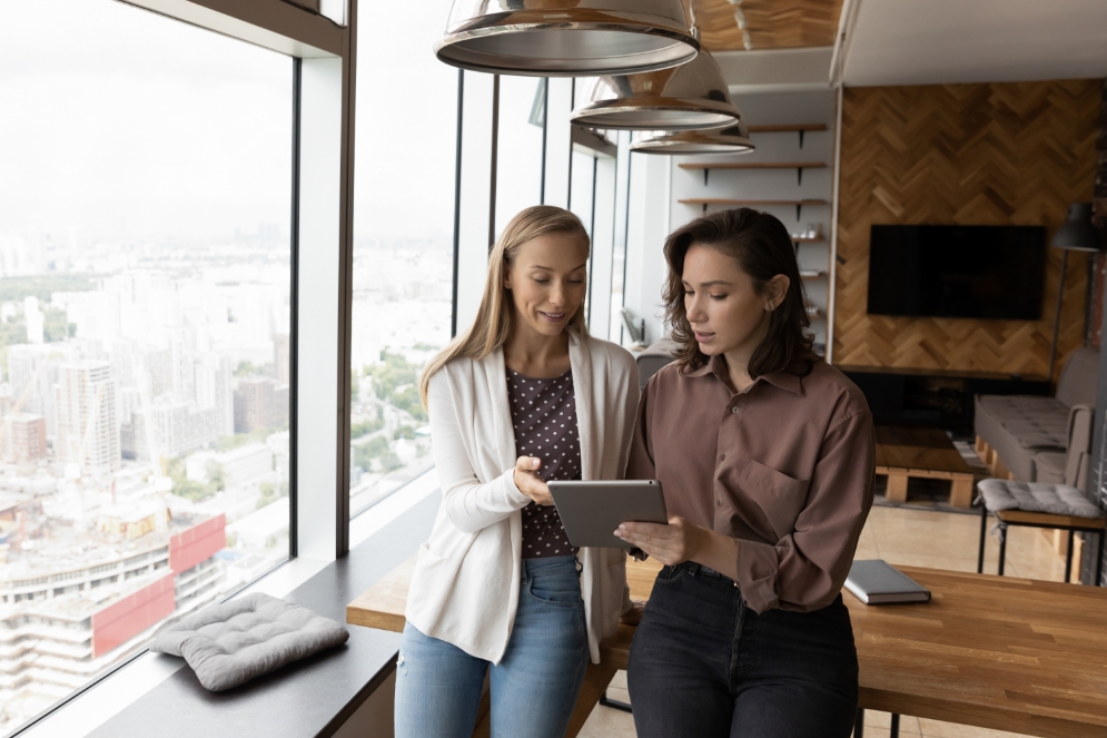 two women in office working